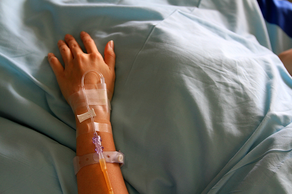 patients-hands-giving-medicine-medical